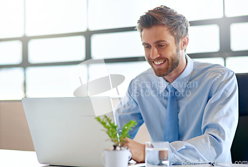 Image of Laptop, happy and research with a business man in the office and working online to finish a project at his desk. Computer, technology and email with a young male employee at work for company reading