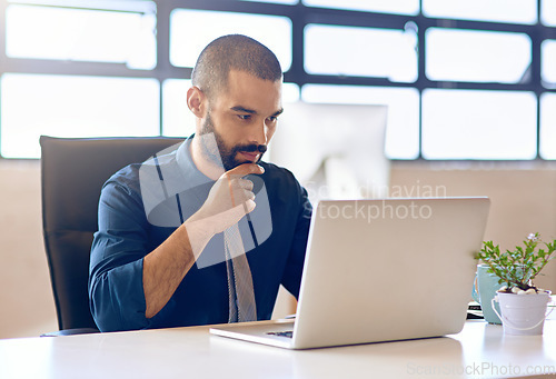 Image of Laptop, idea and research with a business man in the office, working online to finish a project at his desk. Computer, thinking and email with a young male employee at work for company planning