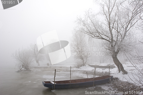 Image of traditional fishing boats on river Danube mid winter