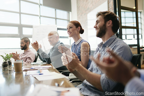 Image of Meeting, success and applause with a business team in the boardroom in celebration of a target or goal. Collaboration, teamwork and support with a group of employee colleagues clapping in the office