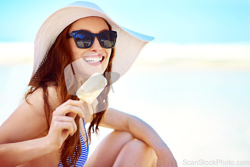Image of Sunglasses, popsicle and portrait of woman at beach on vacation, holiday travel and mockup in summer hat. Happiness, ice cream and female person eating by ocean shore and enjoying snack in Australia.
