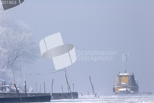 Image of old boats frozen in ice on River Danube mid winter