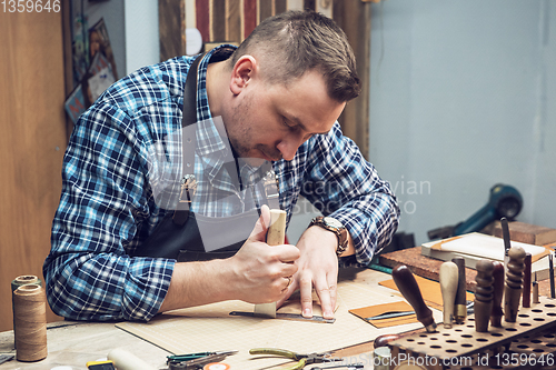 Image of Concept of handmade craft production of leather goods.