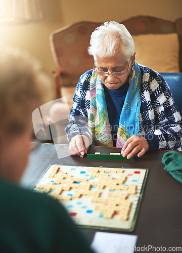 Image of Board game, senior women and nursing home friendship or old people, thinking and play games together in retirement. Elderly friends, entertainment or hobby or table, retired and assisted living