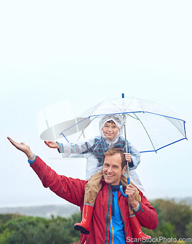 Image of Rain, umbrella and father with child for family portrait outdoor for fun, happiness and quality time. Man and boy kid in nature with hand to catch water drops for freedom, learning and play or mockup