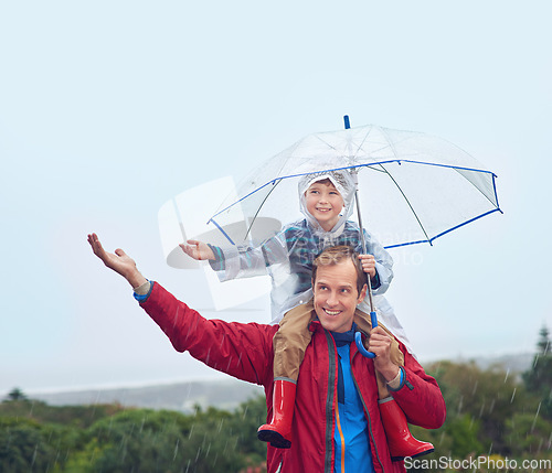 Image of Umbrella, father and child in rain for family fun, happiness and quality time. Happy man and boy kid outdoor in nature with hand to catch water drops for freedom, learning and play with sky mockup