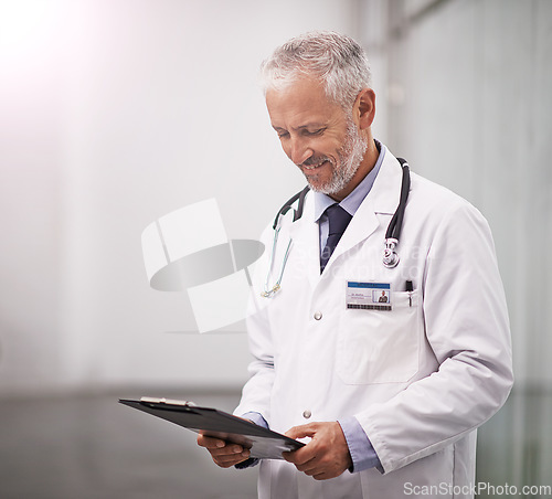 Image of Healthcare, doctor and man reading clipboard with test results in hospital with health insurance mockup space. Professional male medical worker happy with document for consultation schedule or notes