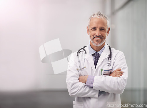 Image of Doctor, healthcare and happy portrait of a man in a hospital with mockup space for health insurance. Professional male medical worker with a stethoscope for a consultation, healing and wellness