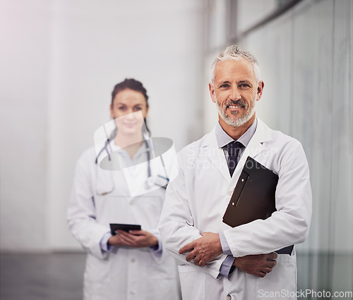 Image of Healthcare, doctor and portrait of a happy man in a hospital with clinic space for health insurance. Senior chief and medical worker or woman together for a consultation, healing and wellness