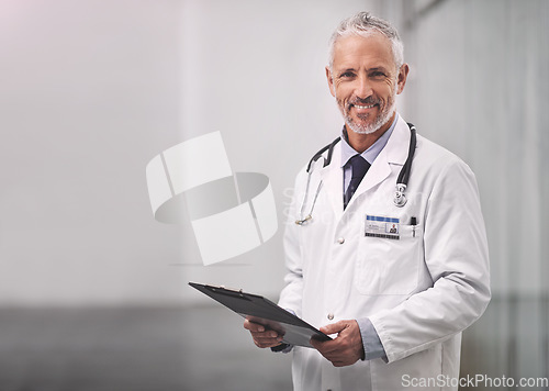 Image of Doctor, healthcare and portrait of a happy man in a hospital with mockup space for health insurance. Professional male medical worker with a stethoscope and clipboard for results, healing or wellness