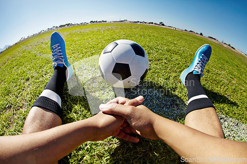 Image of Sport, pov and shoes of man with soccer ball outdoor, relax and resting after fitness or training. Football, field and hands of male player relaxing on grass at park after workout, match or sports