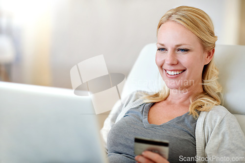 Image of Happy woman, laptop and credit card for online shopping, payment or electronic purchase in living room at home. Excited female person or shopper with smile on computer for ecommerce, app or banking