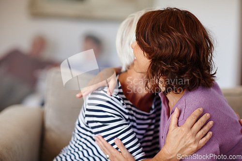 Image of Woman, grandmother and hug on sofa in home with family, care and parent love or smile. Happiness, retirement and adult with elderly mom, together or reunion, hello and embrace and living room