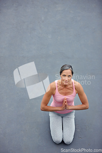 Image of Yoga, mockup and portrait of old woman with praying hands on floor for meditation, healing and balance from above. Mindfulness, prayer pose and space for elderly lady meditating for zen or wellness