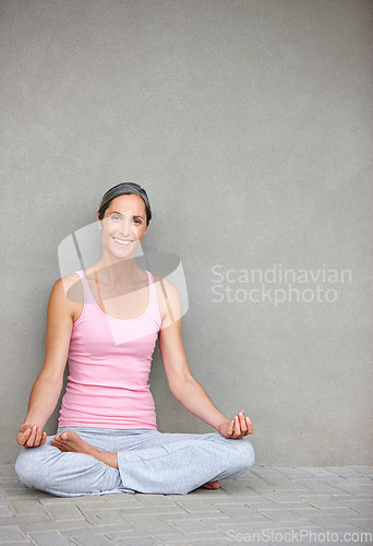 Image of Yoga, mockup and portrait of old woman in lotus pose on floor for meditation, healing and balance on wall background. Mindfulness, face and happy elderly lady with space in retirement for wellness