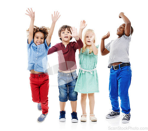 Image of Joy, jumping and portrait of children in studio for diversity, friends and playing. Happiness, youth and smile with group of kids isolated on white background for celebration, playful and energy