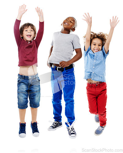 Image of Students, jumping and portrait of children in studio for diversity, friends and playing. Happiness, youth and smile with group of kids isolated on white background for celebration, playful and energy