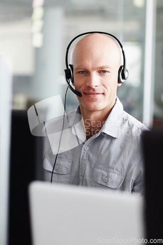 Image of Call center, man and portrait in office communication, technical support, information technology and computer. Face of IT agent, web consultant or person with tech job for client or customer service