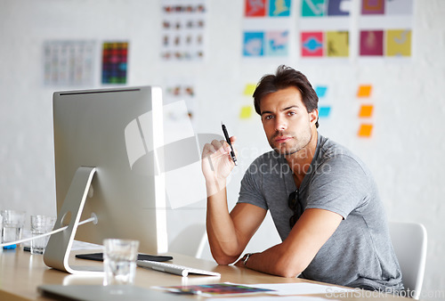 Image of Computer, portrait and pen for man planning, ideas and creativity for online career, graphic design and website. Creative, face and serious person on desktop pc, startup business and office workplace