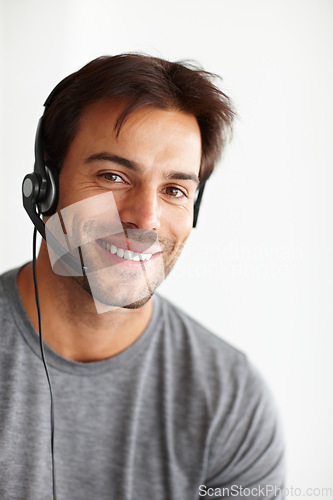 Image of Portrait, call center and happy man isolated on a white background in virtual communication or technical support. Face of business agent, consultant or sales person for telemarketing career in studio