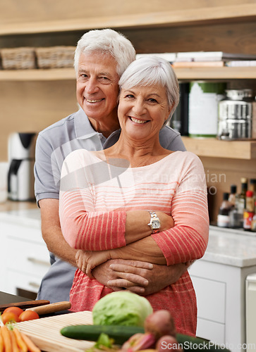 Image of Cooking, love and portrait of old couple in kitchen for salad, health or nutrition. Happy, smile and retirement with senior man hugging woman and cutting vegetables at home for food, dinner or recipe