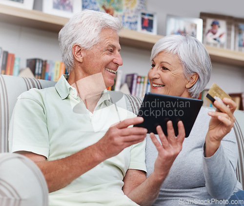 Image of Senior couple, tablet and credit card for online shopping on living room sofa together at home. Happy elderly man and woman smiling on technology for ecommerce, banking app or payment on lounge couch