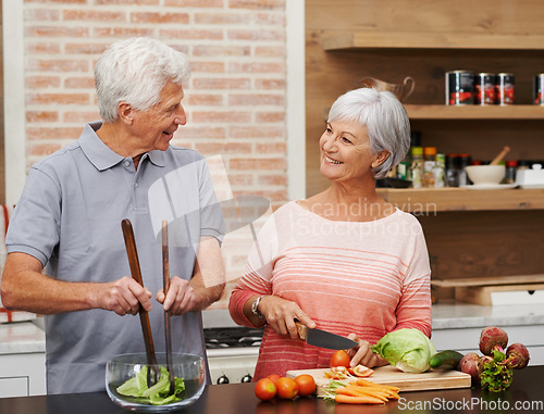 Image of Cooking, health and help with old couple in kitchen for salad, love and nutrition. Happy, smile and retirement with senior man and woman cutting vegetables at home for food, dinner and recipe