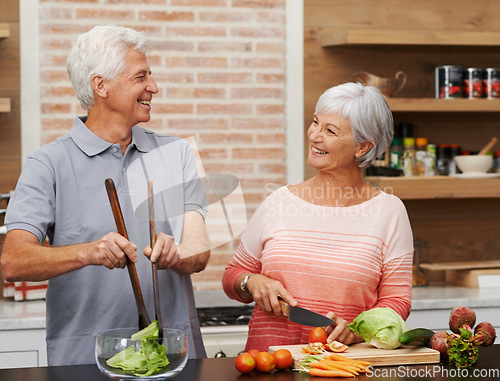 Image of Cooking, health and happy of old couple in kitchen for salad, love and nutrition. Helping, smile and retirement with senior man and woman cutting vegetables at home for food, dinner and recipe