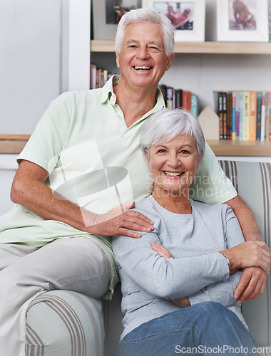 Image of Senior couple, portrait and smile in living room for love, care and quality time together at home. Face of happy elderly man, old woman and enjoy retirement, support and relax in relationship