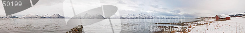 Image of Fjord with red house and snow during the winter