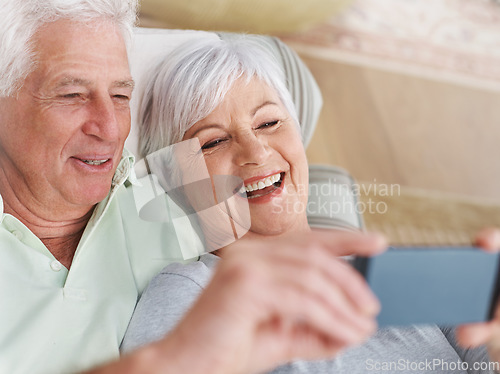 Image of Happy senior couple, selfie and relax on sofa in living room with smile for photo, memory or profile picture at home. Elderly man and woman smiling for photograph, vlog or social media on couch