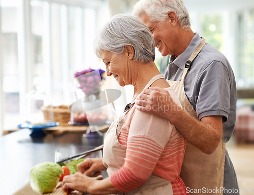 Image of Cooking, health and love with old couple in kitchen for salad, help and nutrition. Happy, smile and retirement with senior man and woman cutting vegetables at home for food, dinner and recipe