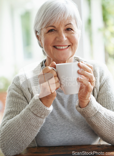 Image of Portrait, happy old woman and cup of coffee in home for break, relaxing morning and retirement. Face, smile and senior lady drinking mug of warm beverage, tea time and happiness of good mood in house