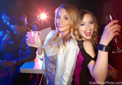 Image of Party, friends and alcohol drinks at a nightclub while dancing, happy and excited to celebrate birthday, new years or happy hour together. Portrait of women with cocktails for a celebration at a club