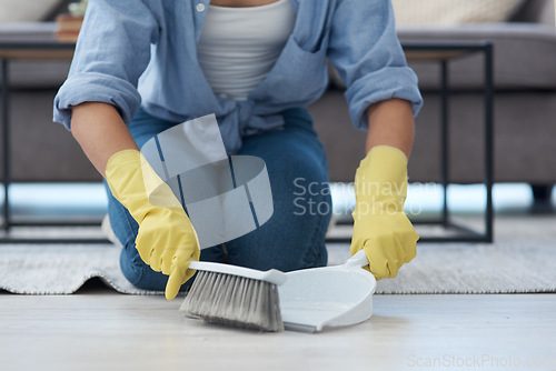Image of Closeup, hand broom and woman sweeping, home and spring cleaning with chores, maid and dirt. Zoom, female person and girl with housekeeping, cleaner and messy with dustpan, domestic lady and tidy