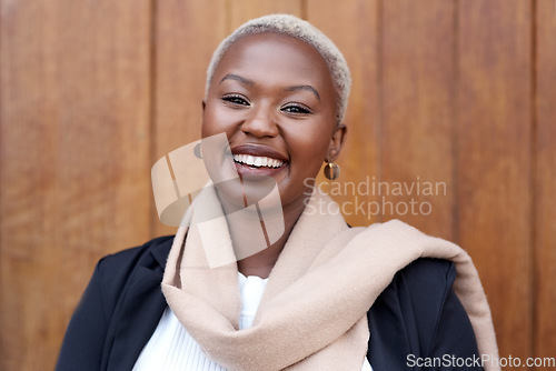 Image of Face, fashion and portrait of a happy black woman with a smile, happiness and positive mindset. Headshot of female model person with beauty laughing against a wooden wall in city for business travel