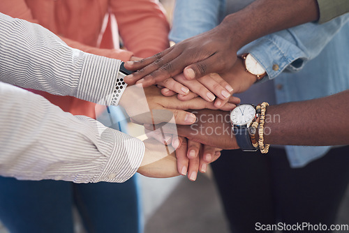 Image of Hands together, team and support with diversity, collaboration and unity in creative group at startup. Motivation, solidarity and trust with teamwork goal, hand stack with people in community