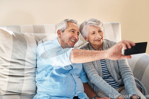 Image of Senior couple, selfie and smile on sofa with happiness on social media, blog or post on internet. Elderly man, woman and photography for profile picture on app, web or happy together on couch in home