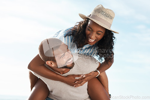 Image of Nature, blue sky and piggy back, happy couple on adventure for romantic summer holiday travel. Love, man and woman with happiness on date, laughing and freedom on tropical vacation time together.