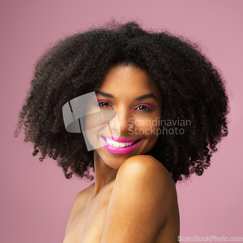 Image of Hair care, face and happy black woman with makeup in studio isolated on a pink background for skincare. Hairstyle portrait, beauty cosmetics and African female model with salon treatment for afro.