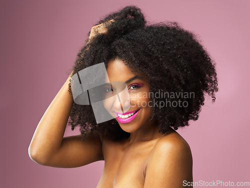 Image of Face, hair care and happy black woman with afro in studio isolated on pink background. Hairstyle portrait, makeup cosmetics and African female model with salon treatment for beauty, growth or healthy