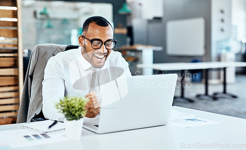 Image of Business man, winning and excited on computer success, news or bonus celebration, cheers or wow in office. Happy, fist and winner, employee or person celebrate on laptop promotion, sales or results