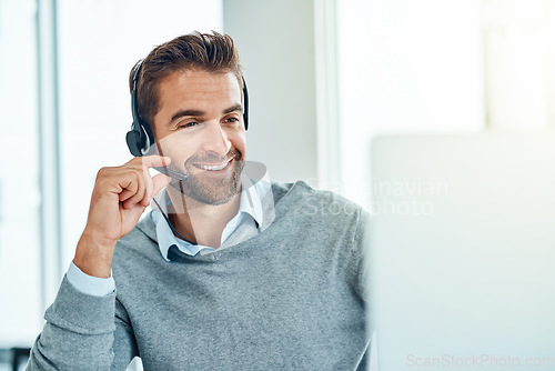 Image of Call center, CRM and man customer care consulting with a smile doing internet telemarketing sales in an agency office. Young, computer and happy male employee working on support service for advice
