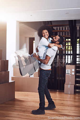 Image of Moving in portrait, couple hug and love with real estate sale and cardboard boxes at new apartment. Happiness, excited and African woman and man together with a smile from mortgage and property deal