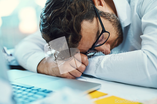 Image of Sleeping, man and tired in office with burnout, fatigue and overworked business employee on desk with glasses, paper and laptop. Businessman, lawyer and exhausted sleep in company workplace