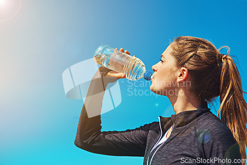 Image of Woman drinking water, health and fitness with blue sky, athlete outdoor with hydration and mockup space. Sports, exercise and female person with h2o drink in bottle, workout and break from training