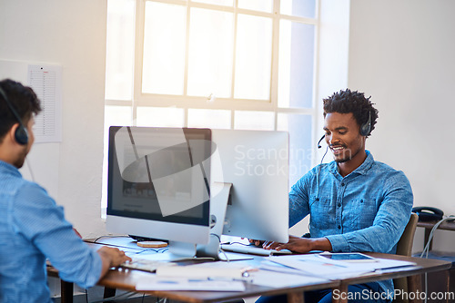 Image of Telemarketing, customer service and men with computers, talking and conversation for help, advice and friendly. Male coworkers, happy operator and consultants with headset, happiness and call center