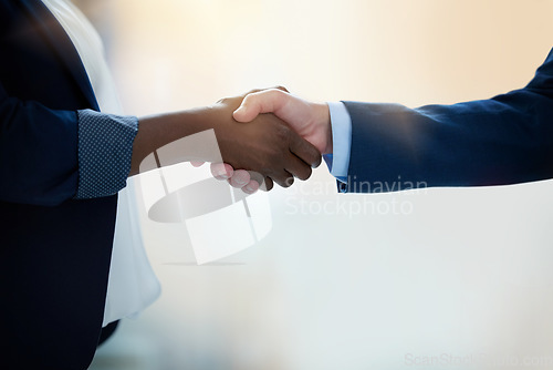 Image of Closeup hand shake, business people and agreement in office for hiring, collaboration and thank you. Woman, businessman and shaking hands with respect, deal or welcome for recruitment at interview