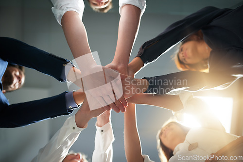 Image of Hands together, support and business people in team with goals, solidarity and trust with professional community. Diversity, collaboration and corporate group in meeting in low angle and commitment