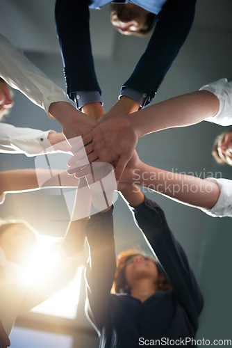 Image of Hands together, solidarity and business people in team with low angle, support and trust with professional community. Diversity, collaboration and corporate group in meeting with goals and commitment